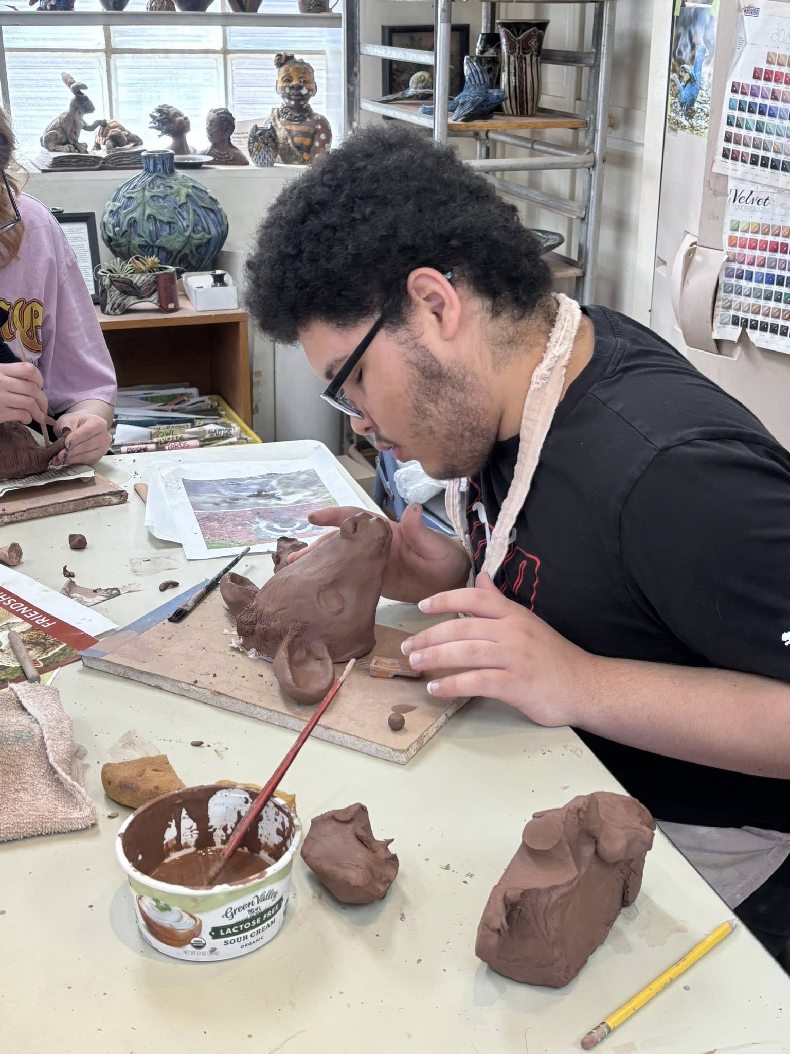 A Main Street School high school student focused on hands-on project work